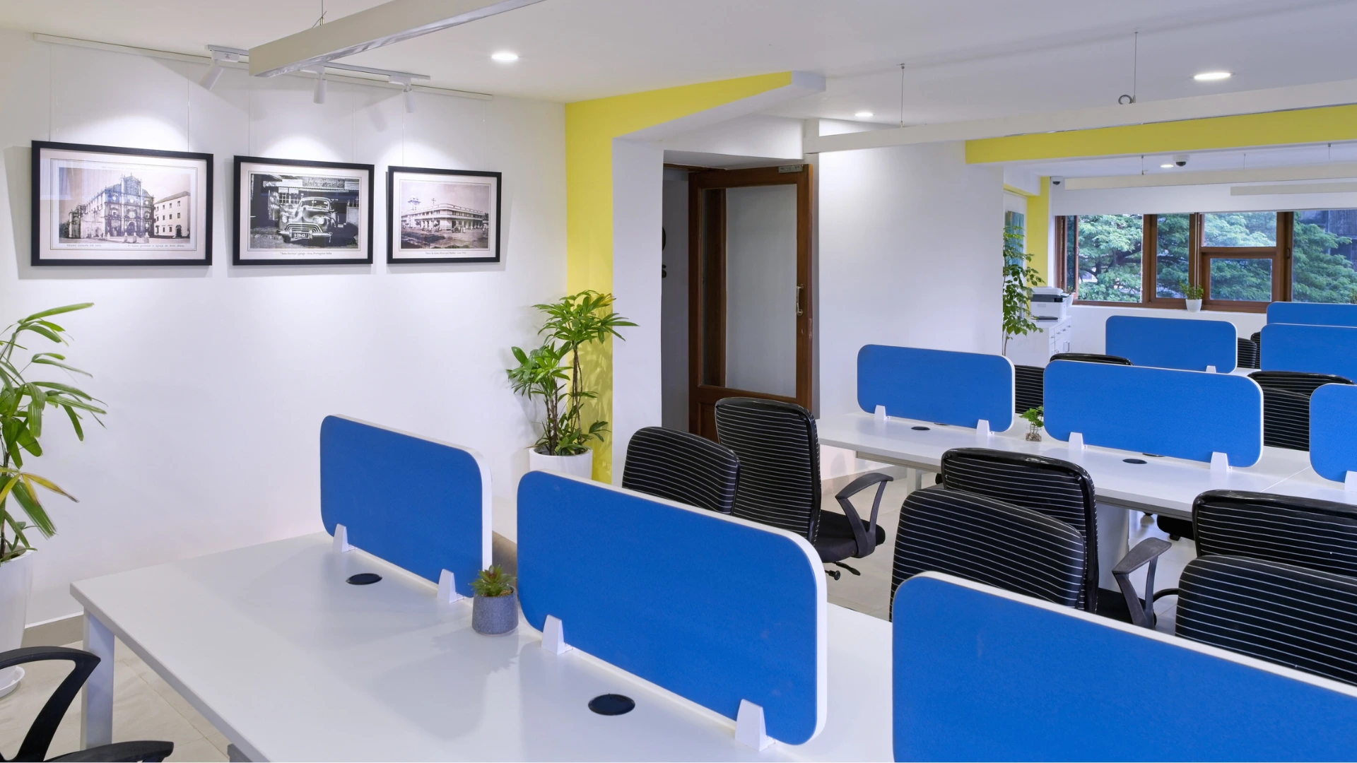 Professionals collaborating in a vibrant coworking space in Panaji, Goa, showcasing a modern and flexible work environment that blends productivity and a relaxed coastal lifestyle.